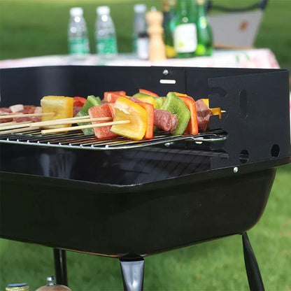 Portable outdoor barbecue oven with metal grill for camping and outdoor use