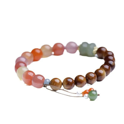 8mm Hetian jade agate bracelet showing diamond-shaped persimmon design elements on natural stone