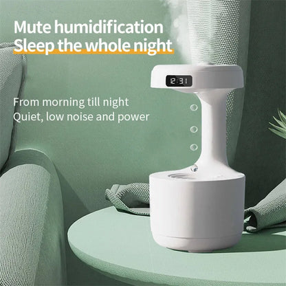 White columnar anti-gravity humidifier with LED clock display on a wooden desk