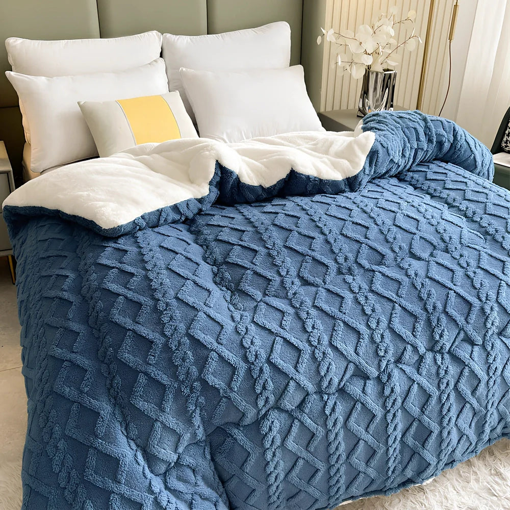Double quilted plush quilt in sapphire blue showing detailed stitching and German velvet texture