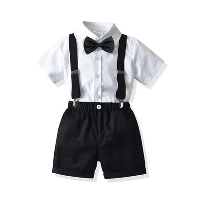 Boys' white short-sleeved shirt with suspender shorts set showing single-breasted closure and adjustable straps