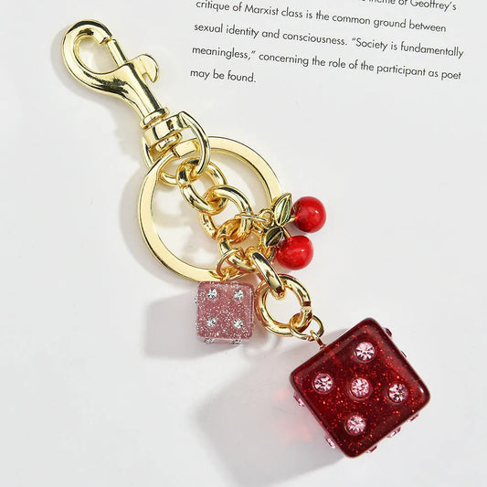 Square metal keychain pendant with cherry two-tone electroplated finish and quadrilateral pattern design
