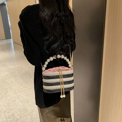 Women's soft PU crossbody bag with beaded accents, round shape, and single shoulder strap in black colour.