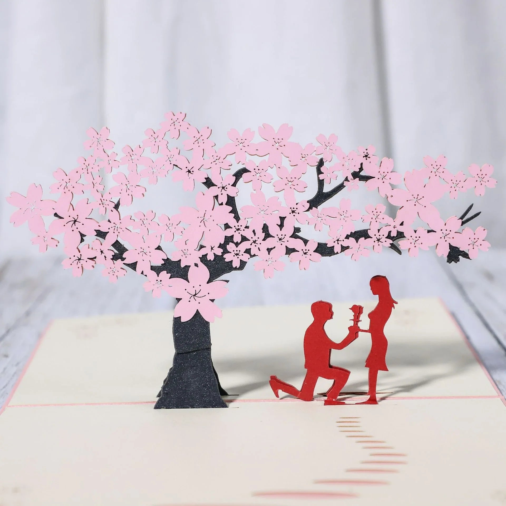 Enchanting 3D pop-up wedding invitation cards with laser-cut designs and floral motifs