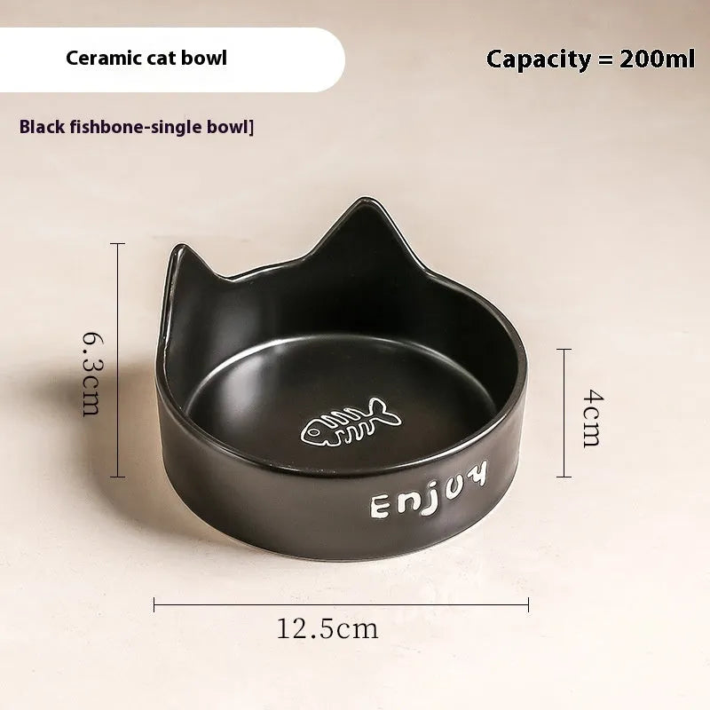 Porcelain cat bowl with anti-tumble wooden frame in pink with a cat paw design