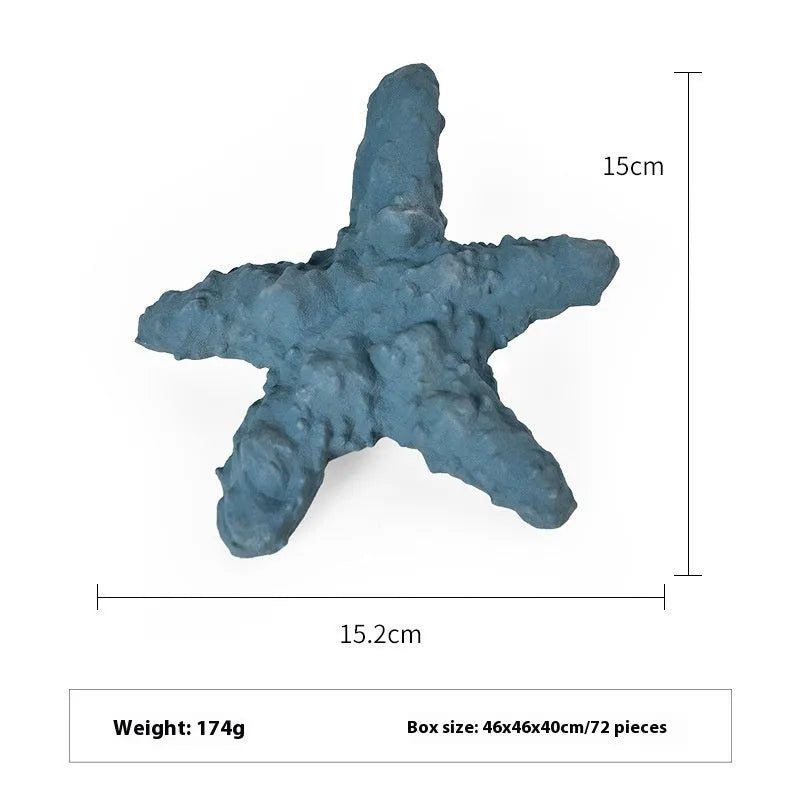 Blue rubber shark-shaped dog toy with food dispensing openings on a white background.