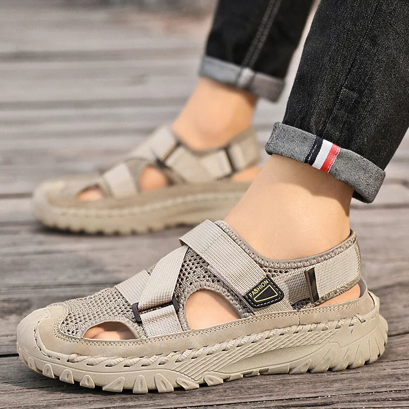 Men's grey casual sandals with hollow mesh upper, elastic band, and rubber sole.