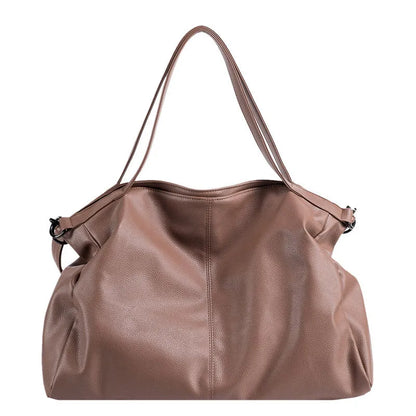 Large soft black PU messenger bag with long shoulder strap and front car suture detailing
