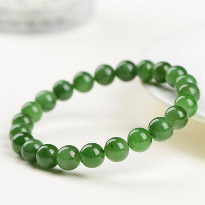 Natural jasper ball bracelet with polished Hetian jade beads in multiple sizes from 4mm to 12mm on wrist