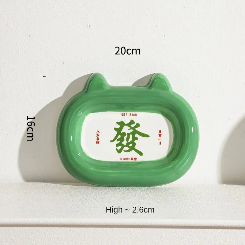 Handcrafted ceramic pet bowl with an animal design, for cat or dog food and water.