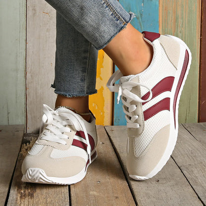 Wine red retro sneakers with cross-strap detail and breathable mesh surface