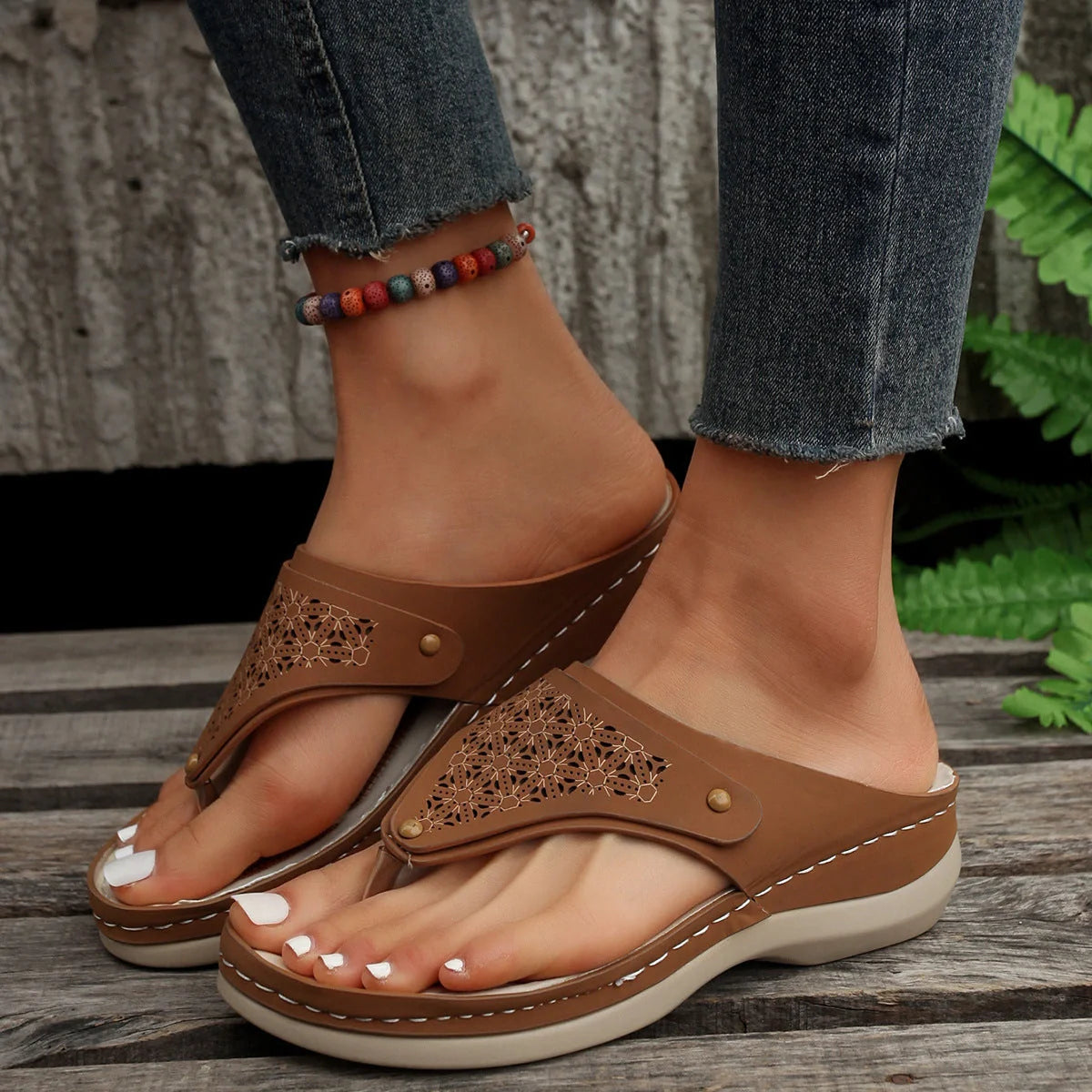 Women's PU thong sandals in various colors, showcasing segmented toe design