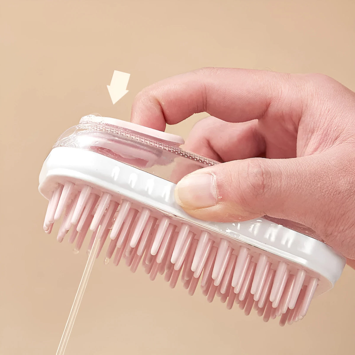 Flexible silicone pet bath brush with an adjustable hand strap in grey and pink colour options.