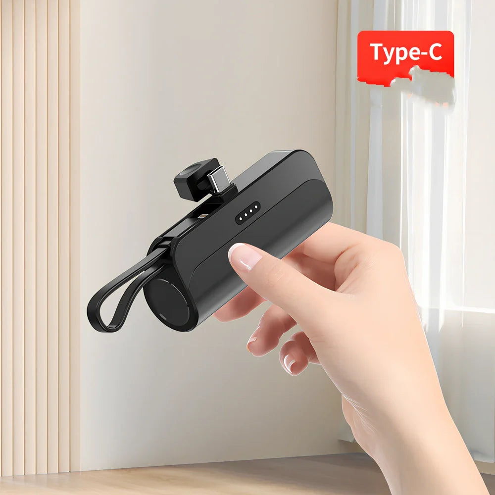 White capsule power bank showing compact 79mm size with USB charging ports visible