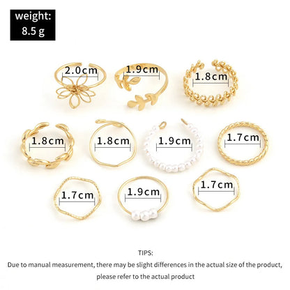 Women's gold openwork flower ring set showing detailed floral cut-out pattern and glossy electroplated finish