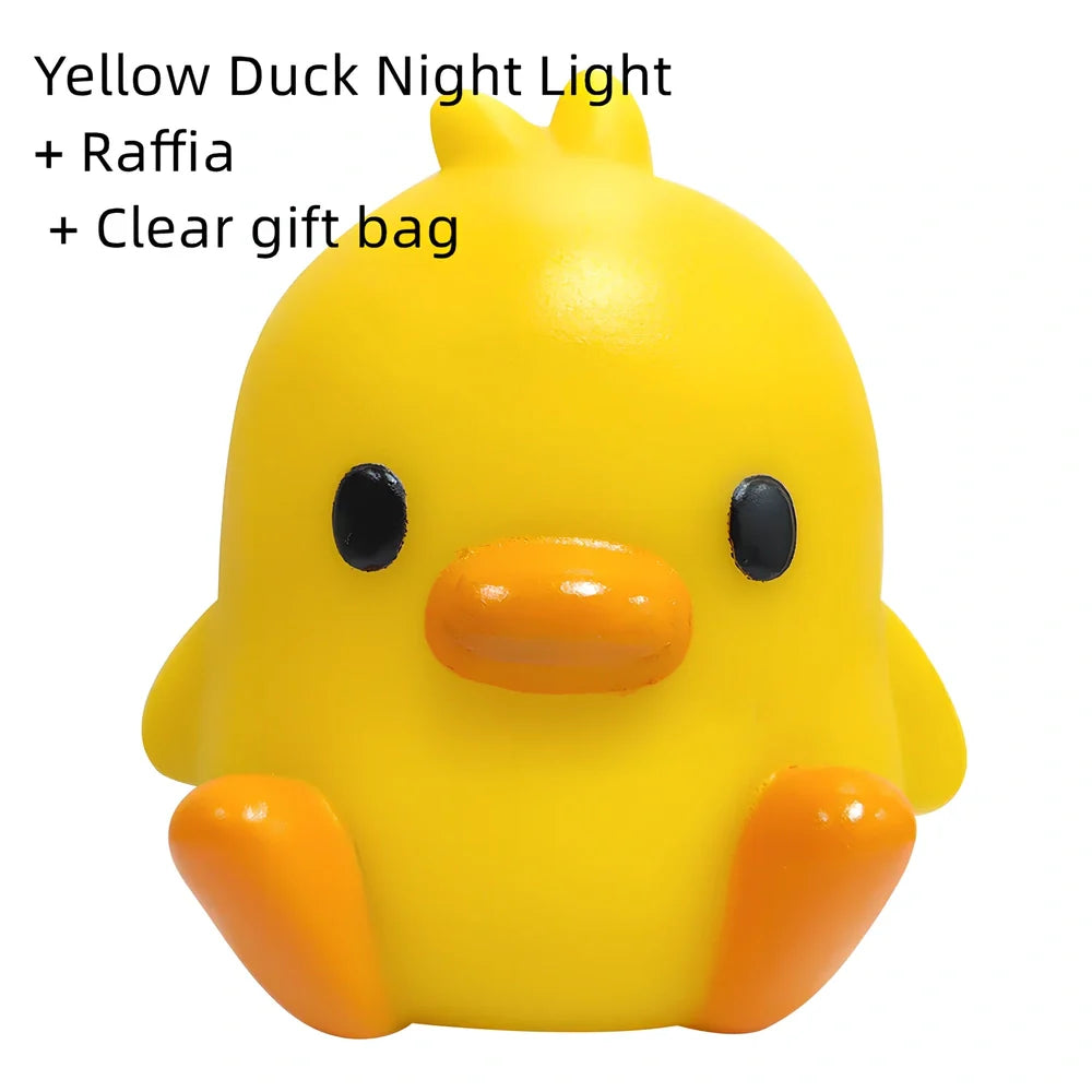 Small yellow duck-shaped night lamp measuring 6cm tall with warm LED light