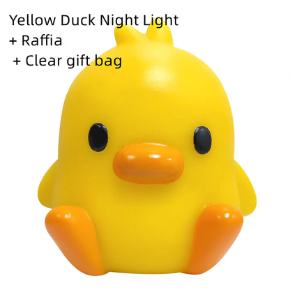Small yellow duck-shaped night lamp measuring 6cm tall with warm LED light