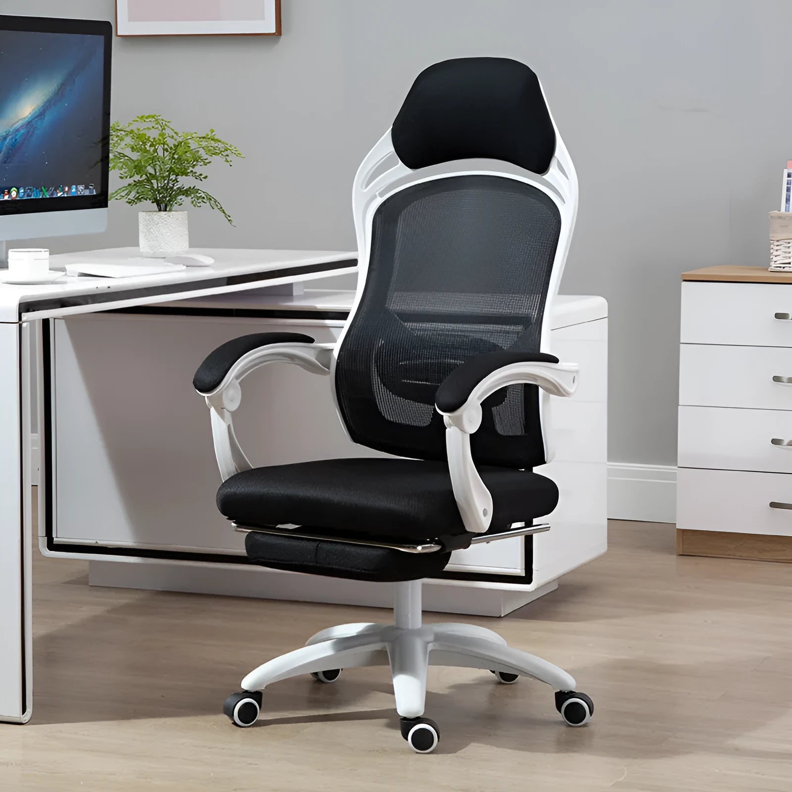 Ergonomic black computer gaming chair with reclining backrest and adjustable armrests