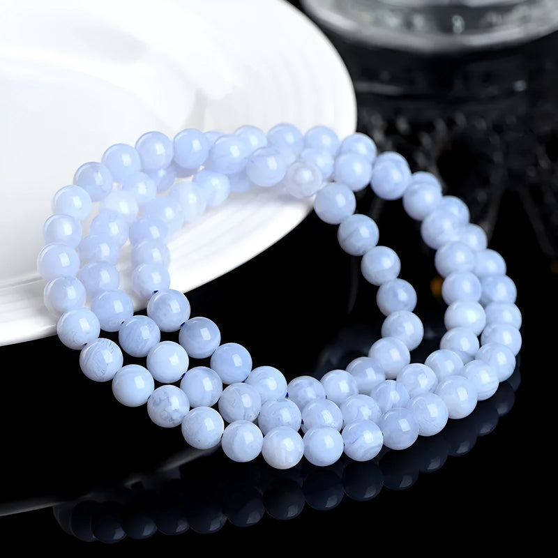 Crystal Natural Blue Pattern Agate Ball Bracelet with Blue Striped Agate Scattered Beads: A unisex accessory featuring 6-6.8mm agate beads in a multi-circle blue pattern with Ruyi elements for a distinctive look.