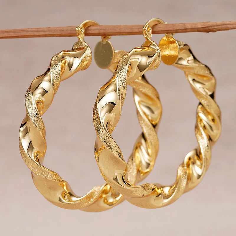 Geometric drop-shaped ear clip earrings with electroplated finish in various colours