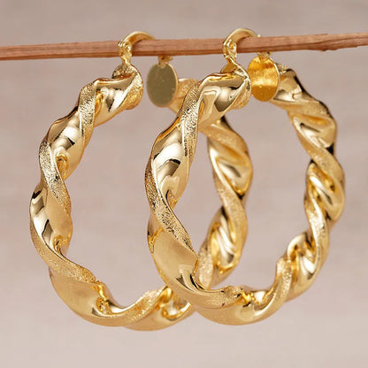Geometric drop-shaped ear clip earrings with electroplated finish in various colours