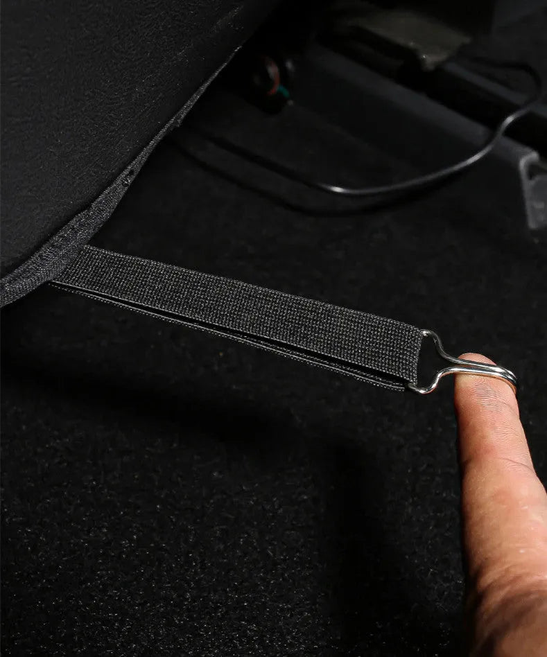 Set of two black leather rear anti kick pads for car seat back protection.