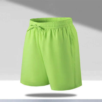 Man wearing black loose-fit ice silk sports shorts with a micro-elastic waistband, suitable for running or casual summer wear.