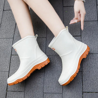 Women's low-cut white waterproof plastic shoes with a non-slip rubber sole on a plain background.