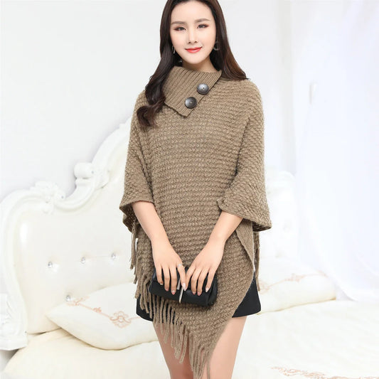 Sleeveless polka dot shawl in apricot colour draped over chair, showing 150cm length and acrylic fibre texture