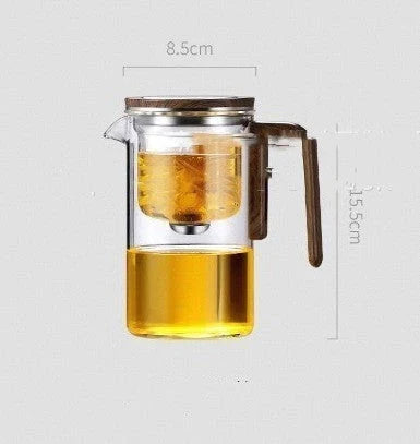 Elegant glass tea infuser pot with magnetic separation technology, wooden handle, and precise pouring spout