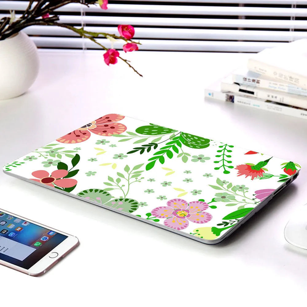 Plastic protective shell with floral pattern for Apple MacBook laptop showing sampling flower design