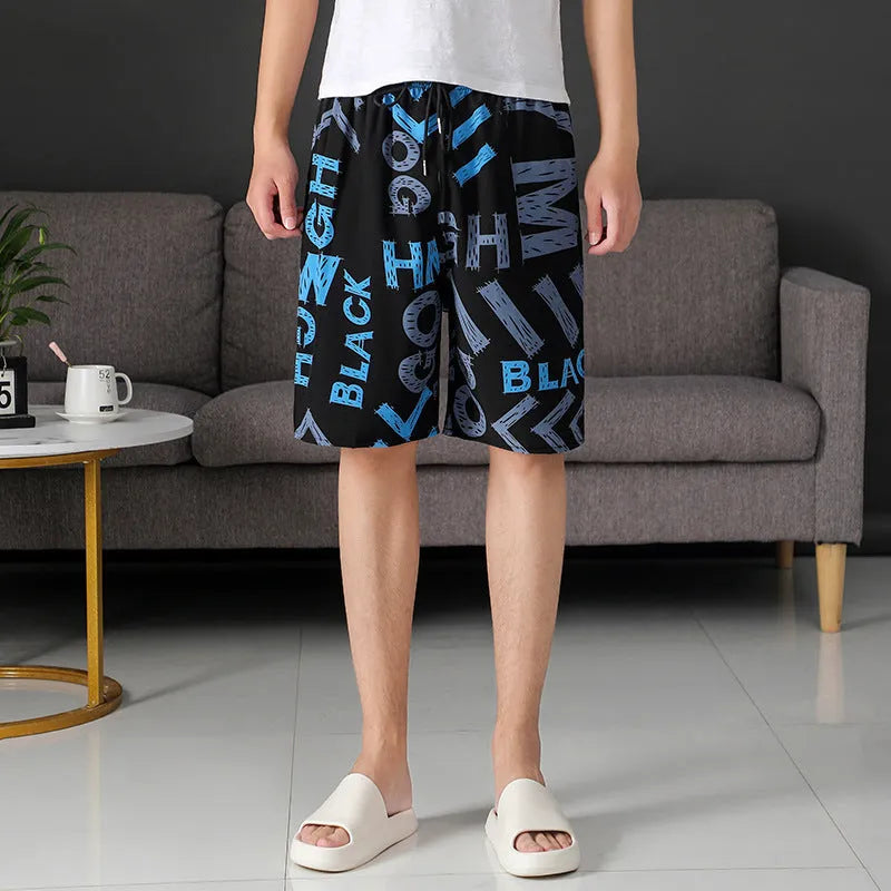 Man wearing loose-fitting striped beach pants made from quick-dry ice silk fabric.