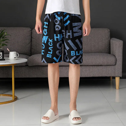 Man wearing loose-fitting striped beach pants made from quick-dry ice silk fabric.