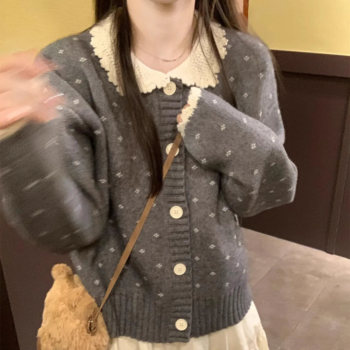 Retro floral patterned cardigan coat with a Peter Pan collar and button front.
