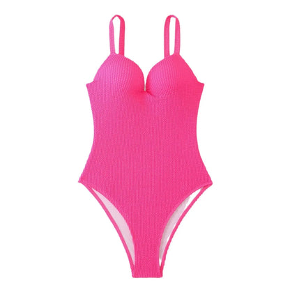 Women's black one-piece swimsuit with a sunken vertical stripe detail, shown on a model, featuring a sleeveless design.