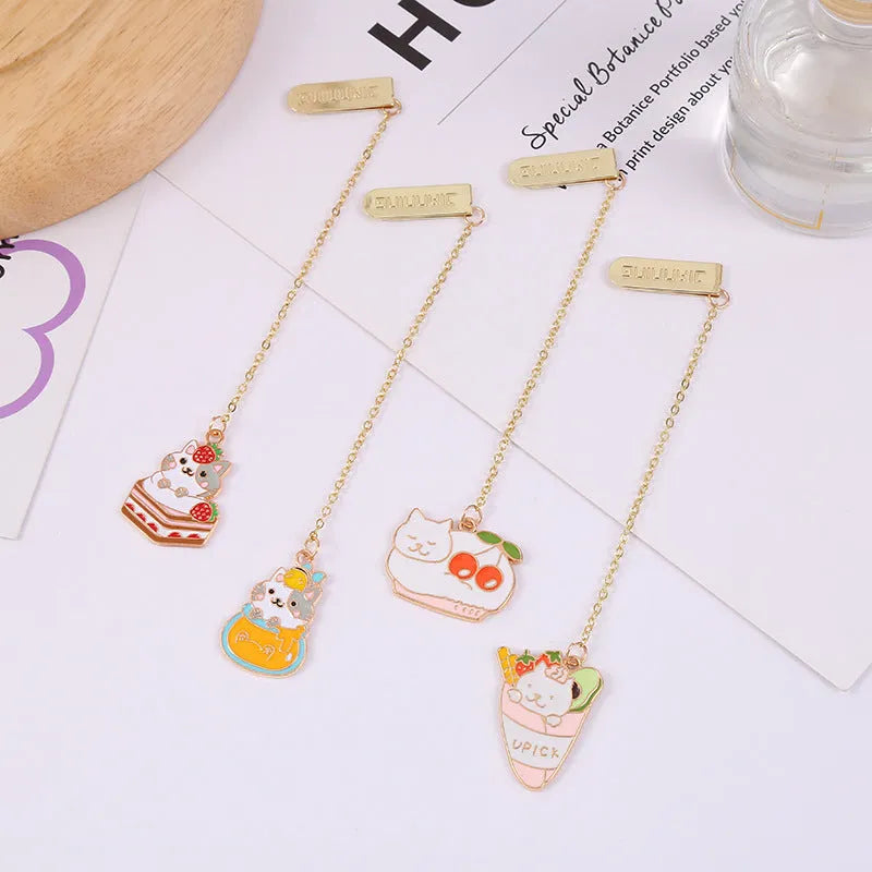 Jane Lime Foodie cat creative metal bookmark with cartoon pendant on a book page.