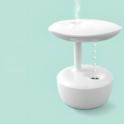 White lotus leaf shaped USB humidifier with mist output and LED illumination on wooden surface