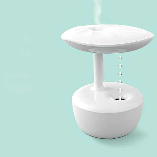 White lotus leaf shaped USB humidifier with mist output and LED illumination on wooden surface