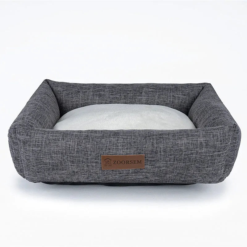 Grey linen fabric square dog bed measuring 60x50cm on a wooden floor