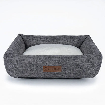 Grey linen fabric square dog bed measuring 60x50cm on a wooden floor