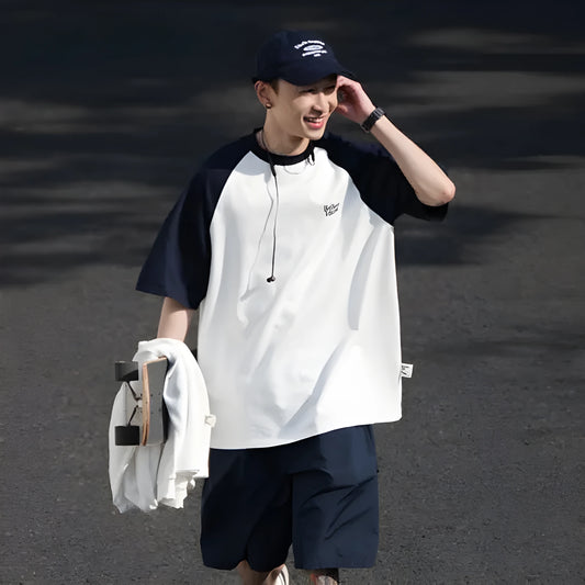 Men's blue casual raglan sleeve t-shirt with loose fit, thin polyester blend fabric.