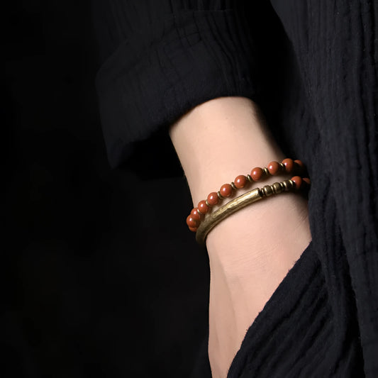 Layered retro ethnic bracelet for men and women with stone beads and brass spacers.