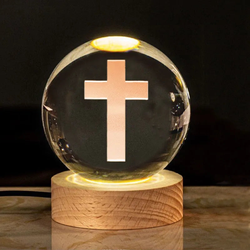 White crystal ball ornament with solid wood warm light base, showing purity engravings like Cross and Maria for desk decor
