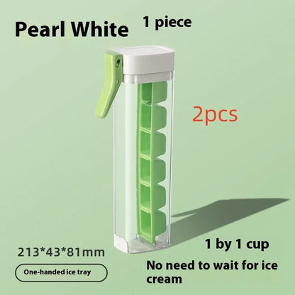 Blue press-release ice cube tray with storage box on a kitchen counter