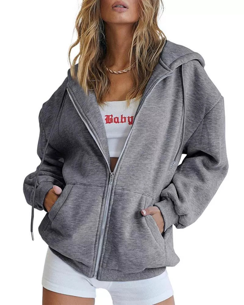 Women's solid color zipper hooded sweatshirt with drawstring, available in multiple colors and sizes.