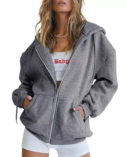 Women's solid color zipper hooded sweatshirt with drawstring, available in multiple colors and sizes.