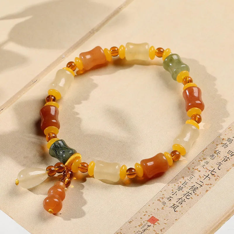 Natural Jinsi Jade small bone beads bracelet with geometric shape and Chinese auspicious patterns