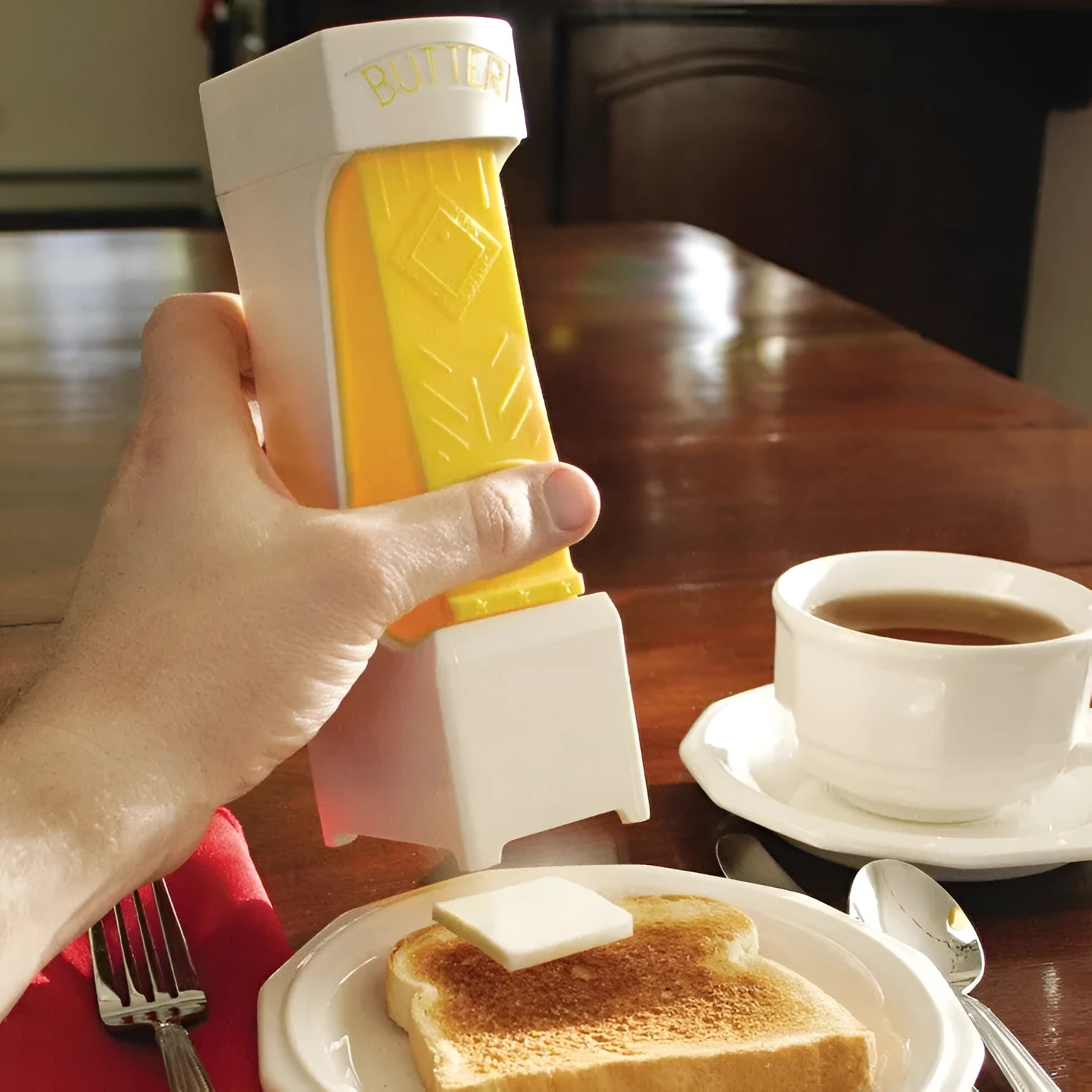 Yellow ABS plastic butter cutter with stainless steel blades for quarter-pound stick butter bars