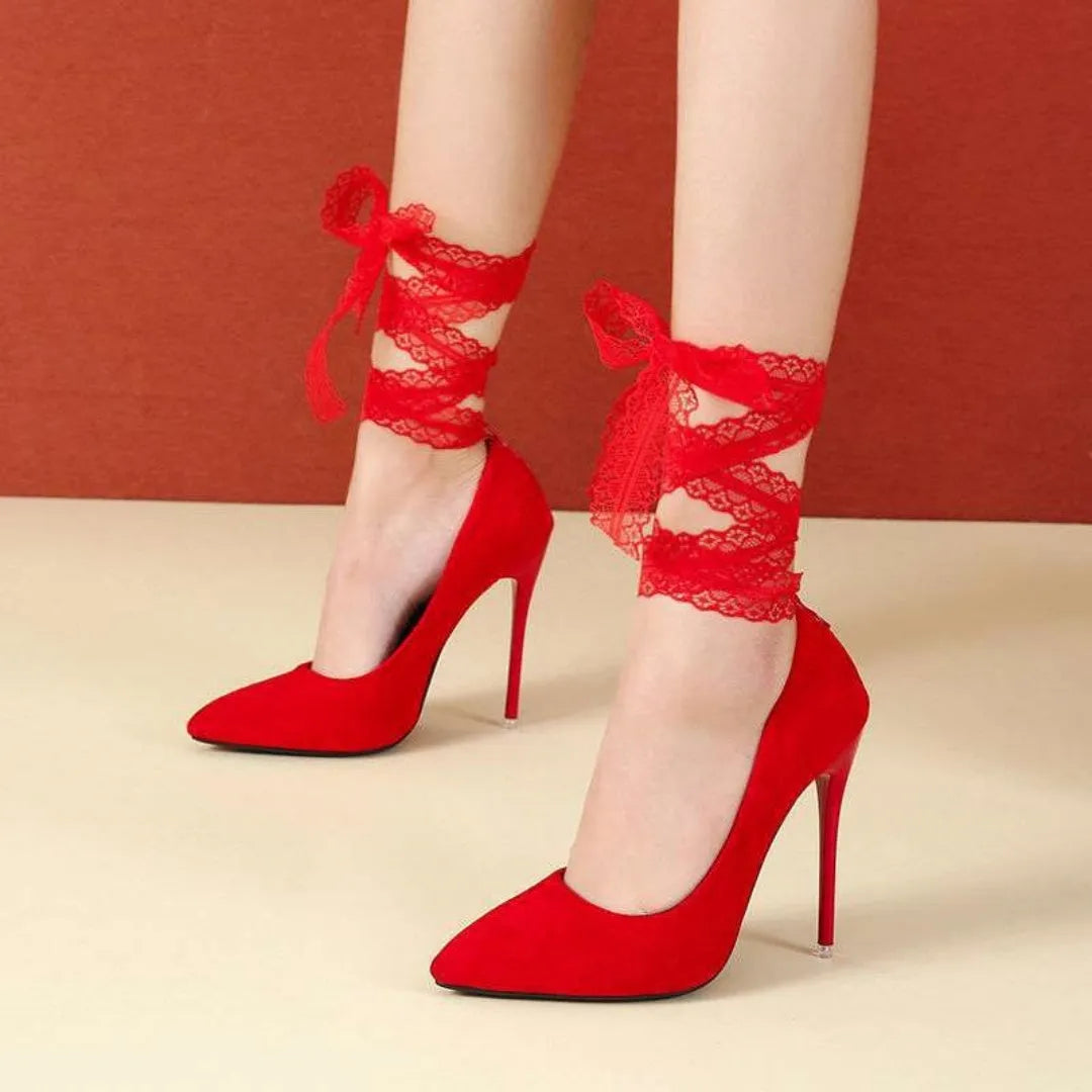 Black pointed toe stiletto sandals with a lace strap and high heel