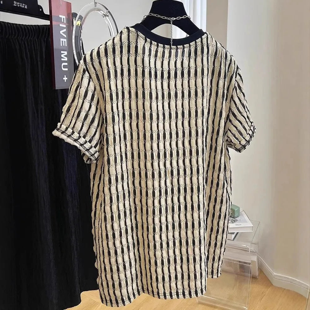 Black and white striped men's loose-fit short sleeve pullover on a hanger